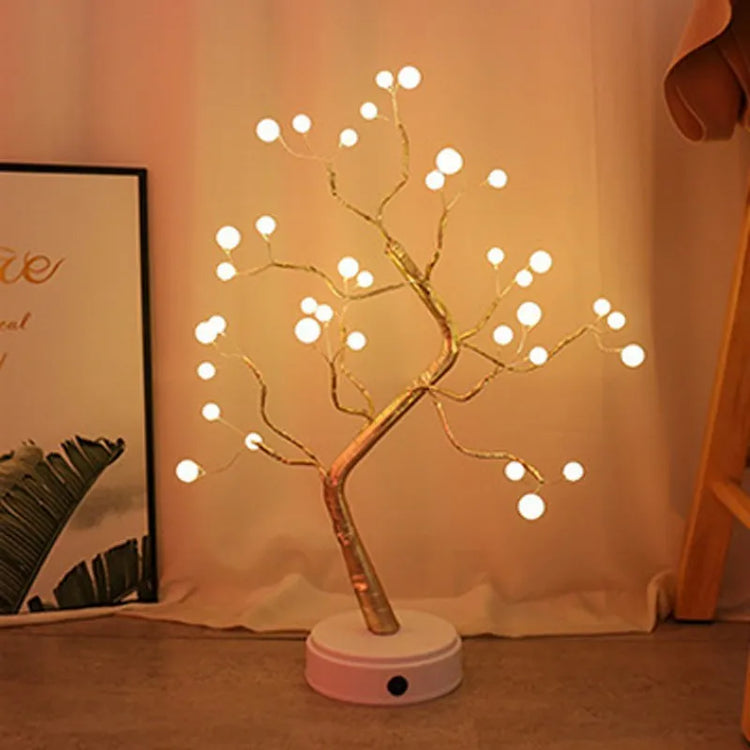 🎄 PearlGlow™ LED Christmas Tree Light with warm white glowing pearl bulbs on golden branches, perfect for cozy holiday ambiance in home décor.
