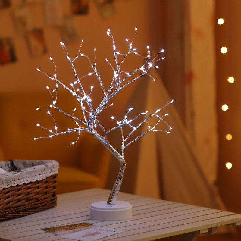 🎄 PearlGlow™ LED Christmas Tree Light in white LED mode with silver branches, creating a serene glow for nightstands or holiday-themed rooms.