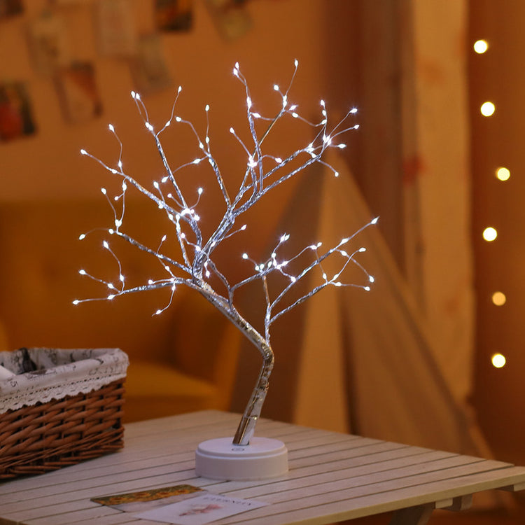 🎄 PearlGlow™ LED Christmas Tree Light in white LED mode with silver branches, creating a serene glow for nightstands or holiday-themed rooms.