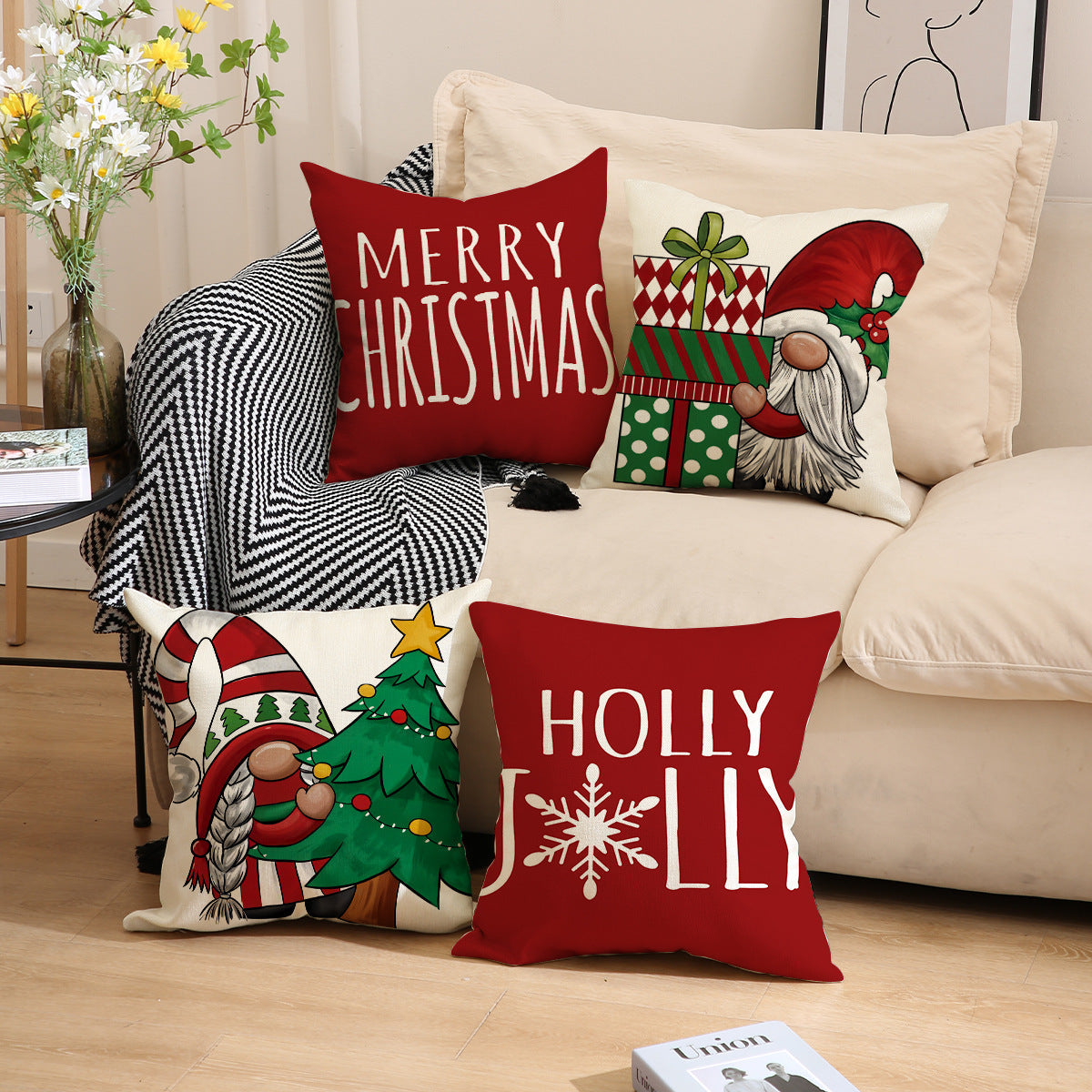 Red Christmas throw pillow covers with festive holiday designs on a beige sofa