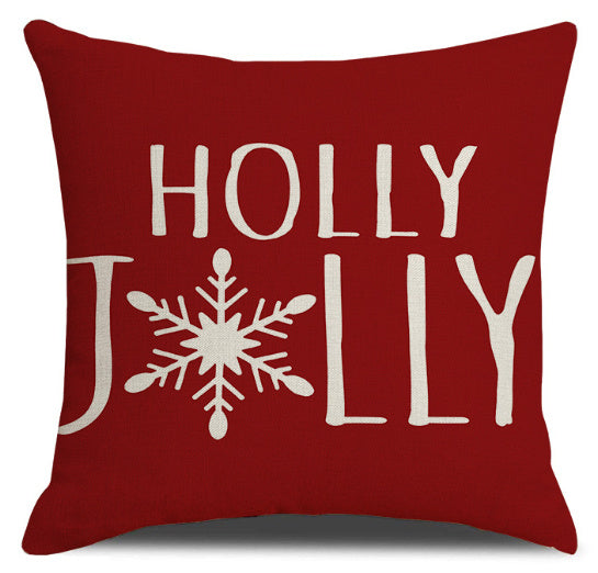 Red Christmas throw pillow covers with holly jolly text and snowflake design for festive decor